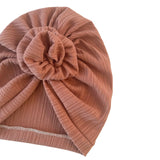 Brown textured turban with a knot on a white background