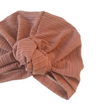 Brown textured headscarf with a knot on a white background