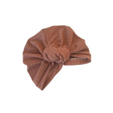 Brown ribbed headband on a white background