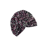 Leopard print headscarf on a white background