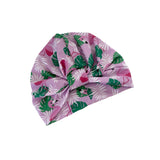 Turban with flamingo and leaf pattern on a white background