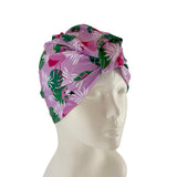 Floral patterned headscarf on a mannequin head against a white background