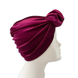 Maroon headscarf on a mannequin head against a white background ireland