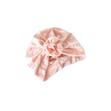 Pink headscarf with a bow on a white background