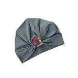 Gray turban with a floral pattern on a white background