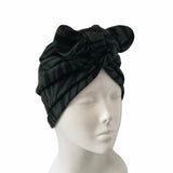 Black turban on a mannequin head against a white background ireland