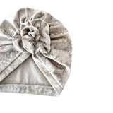 Gray towel with a knot on a white background