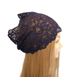 Navy lace headband on a mannequin head with blonde hair against a white background