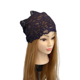 Navy lace headband on a mannequin head with long brown hair against a white background