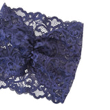 Navy blue lace fabric on a white background