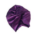 Purple satin turban on a white background