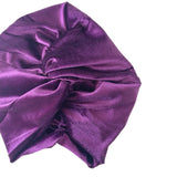 Purple satin turban on a white background
