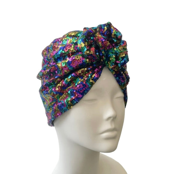 Colorful sequin head wrap on a mannequin head against a white background