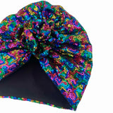 Multicolored sequin head wrap on a white background