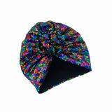 Colorful sequin turban on a white background
