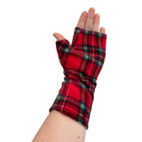 Red plaid fingerless gloves worn on a white background