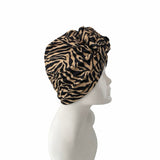 Zebra print headscarf on a mannequin head against a white background