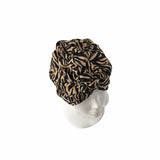Patterned headscarf on a mannequin head against a white background