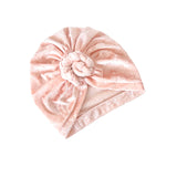 Pink velvet turban on a white background