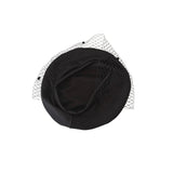 Black hat with a decorative mesh veil on a white background