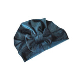 Blue headband with a bow on a white background