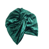 Green velvet turban on a white background