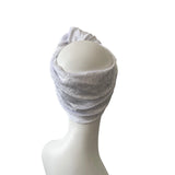 white headscarf on a mannequin head against a white background