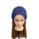 Blue lace headband on a mannequin head with brown hair against a white background