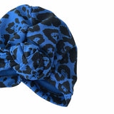 Blue and black patterned headscarf on a white background
