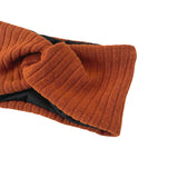 Brown knitted scarf on a white background