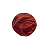 Brown round fabric item on a white background