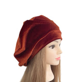 Brown beanie on a mannequin head with long brown hair against a white background