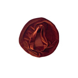 Brown velvet turban on a white background