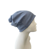 Blue knit hat on a mannequin head against a white background