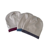 Three beanie hats with different color bands on a white background