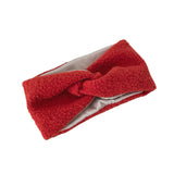 Red knitted headband on a white background