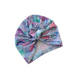 Colorful patterned headscarf on a white background