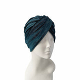 Blue textured headscarf on a mannequin head against a white background