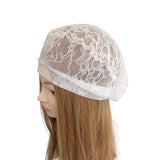 White lace cap on a mannequin head with brown hair against a white background