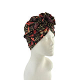 Floral patterned headscarf on a mannequin head against a white background
