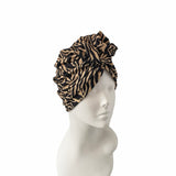 Zebra print headband on a mannequin head against a white background