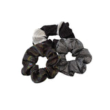 Set of four patterned scrunchies on a white background