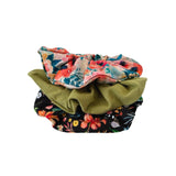 Three floral scrunchies stacked on a white background