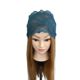 Blue lace headband on a mannequin head with brown hair against a white background