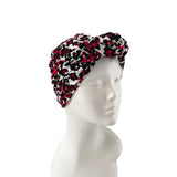 Patterned headband on a mannequin head against a white background