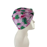 Floral patterned headscarf on a mannequin head against a white background