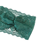 Teal lace headband on a white background