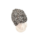 Leopard print headscarf on a mannequin head against a white background
