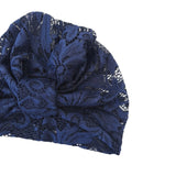 Blue lace headscarf on a white background