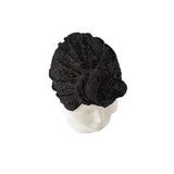 Black textured head wrap on a mannequin head against a white background